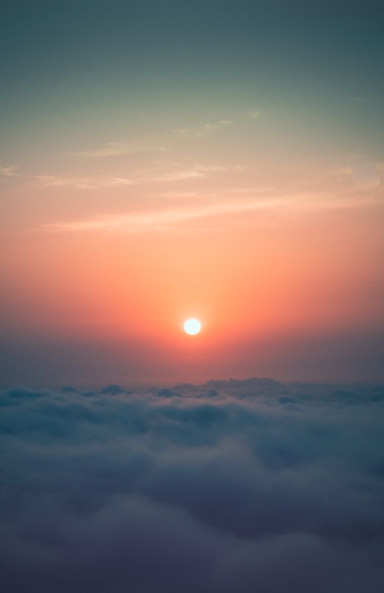 Beautiful sunrise over clouds in Gomi, Georgia, capturing vibrant colors and tranquil sky.