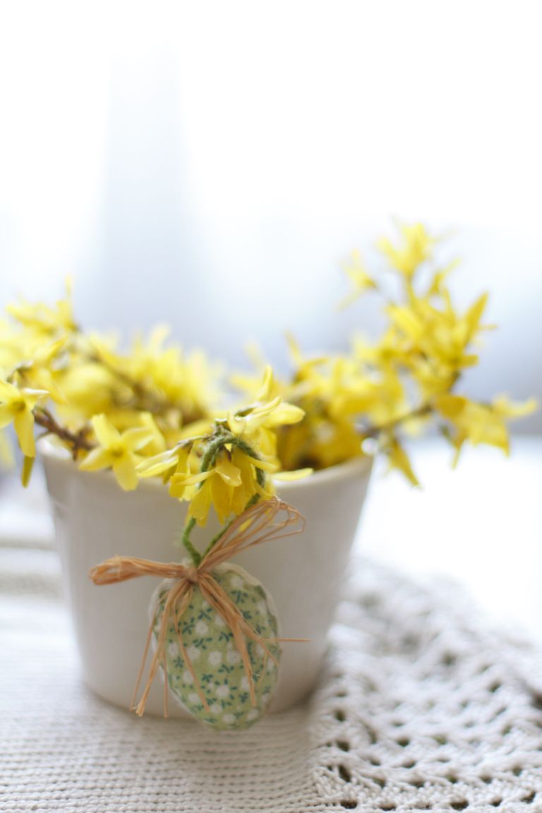 Close-up of yellow flowers in a decorative potted plant for spring decor.